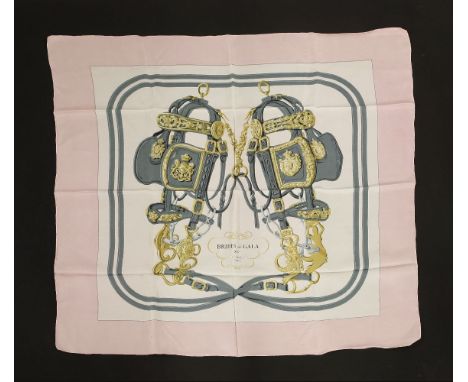 An Hermès silk scarf,'Brides de Gala', by Hugo Grygkar, pink and white ground with equestrian design, and an Hermès scarf,'Ro