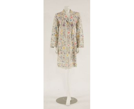 A 1930s white silk day coat, embroidered oriental floral design with revere collar and single button to front