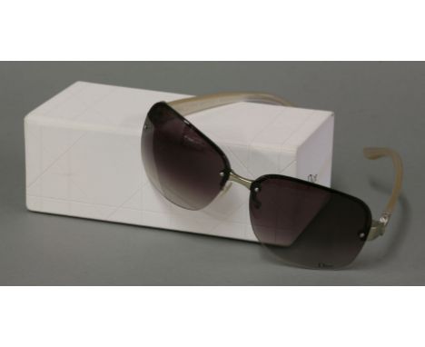 A pair of Christian Dior sunglasses,mother-of-pearl arms with silver tone CD medallion and tinted graduated brown lenses, in 