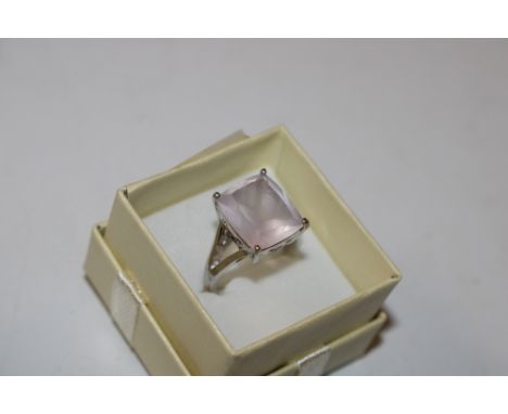 A large Sterling silver and rose quartz type set ring, size N/O