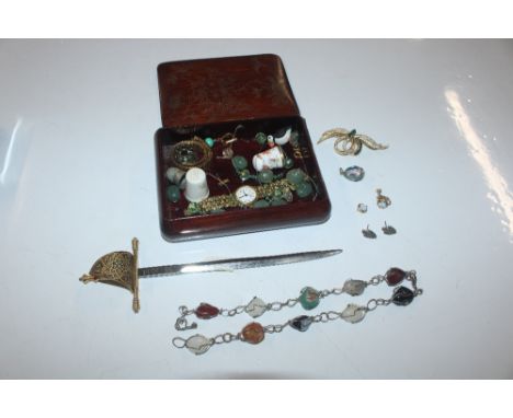 A trinket box and contents of beaded necklace, thimbles, ladies wrist watch, paper knife 