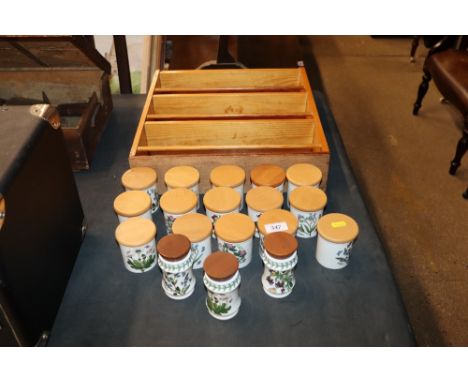 A pine spice rack and a quantity of Portmeirion "Botanic Garden" spice jars