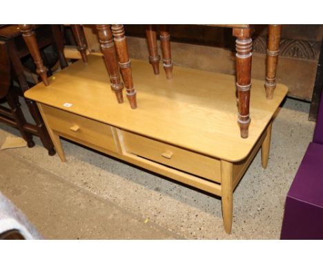 A good quality light oak two drawer coffee table 