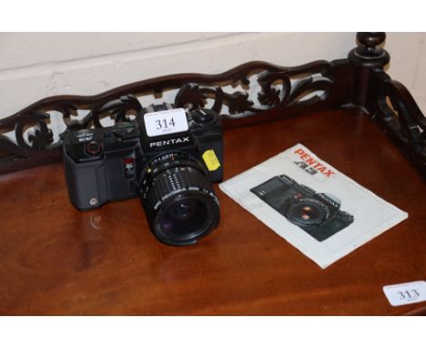 A Pentax A3 camera with manual 