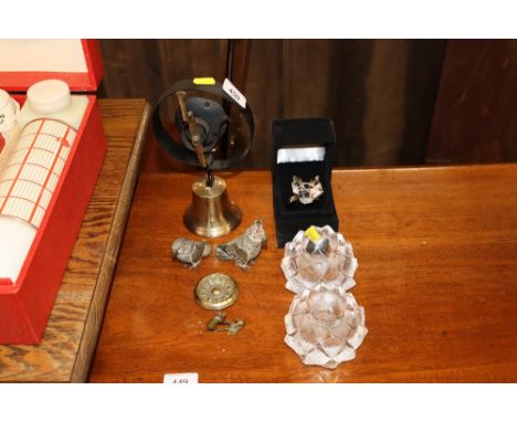 A house bell, two spelter parrot ornaments, a small figure of two men fighting, a brass boss pair of glass candle holders, an