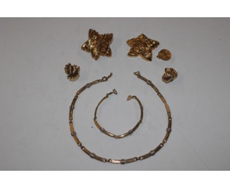 A box containing pieces of Christian Dior (matching necklace, bracelet, and clip-on ear rings) and a pair of Christian Lacroi