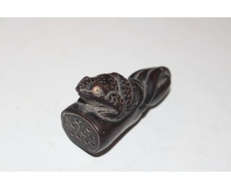 A carved wooden Netsuke 