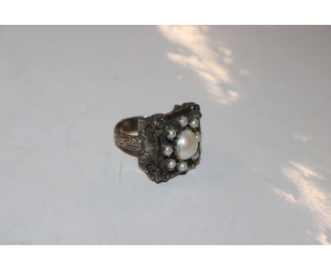 A large 925 Sterling silver and baroque pearl ring with gilt details, size Q/R, approx. weight 16gms 