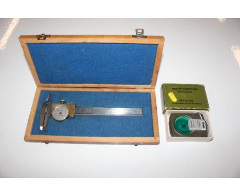 A Sitemaster compass with original; box; and a micrometer in fitted wooden case 