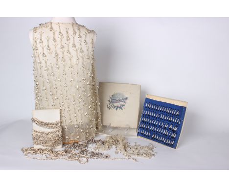 A late 19th/early 20th Century cream net panel embroidered with pearls and beads, a smaller piece of the same with spare/loos