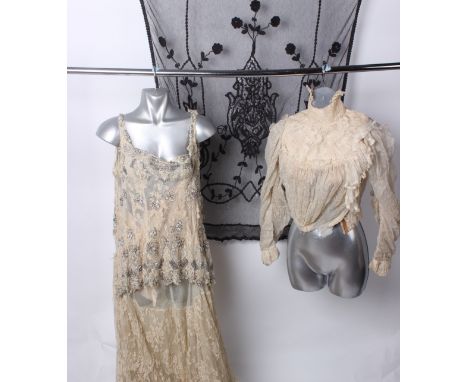 A partially restored Levy Bros. of Texas late 19th/early 20th Century cream blouse; an early 20th Century cream lace dress em