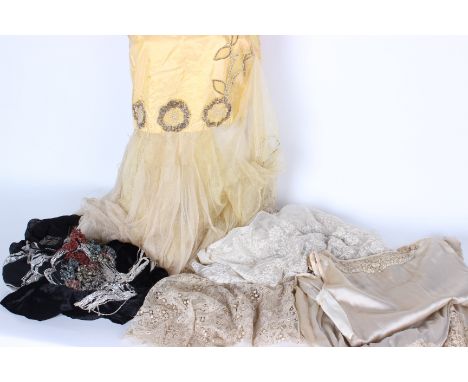 A 1920s cream silk and lace dress; an ivory silk 1930s dress for restoration, a yellow 1920s dress with a net skirt, a panel 