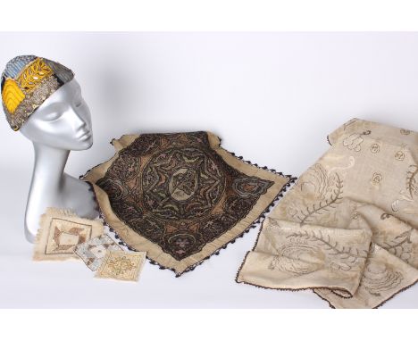 A panel of cream silk embroidered with metallic thread; a pair of embroidered Turkish towel ends, a late 19th Century Turkish