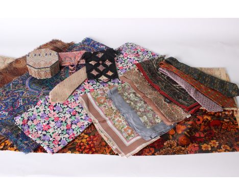 A length of floral dressmaking fabric from Liberty of London; a 1970s Liberty floral oilcloth, a Liberty fabric covered box, 