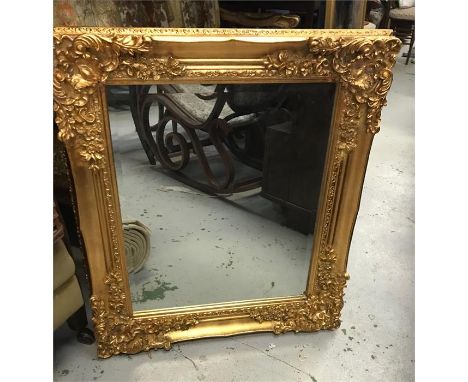 A Large gilt mirror 130cm wide by 107 cm high.