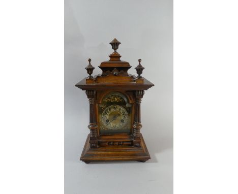 A German Walnut Cased Mantle Clock with Arched Brass Dial and Vase Finials, 14 Day Movement, 46cm High 