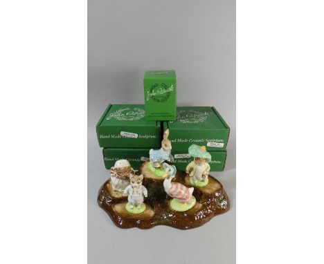 A Collection of Five Boxed Beswick Beatrix Potter Figures Together with a Beswick Tree Trunk Stand 