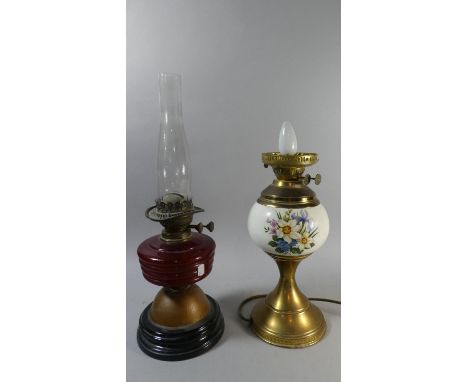 A Late Victorian Oil Lamp with Ruby Glass Reservoir Together with a 20th Century Brass and Ceramic Table Lamp in the Form of 