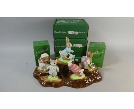 A Collection of Five Boxed Beswick Beatrix Potter Figures and a Beswick Tree Trunk Stand 