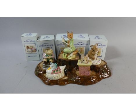 A Collection of Five Boxed Royal Albert Beatrix Potter Figures Together with a Beswick Tree Trunk Stand 