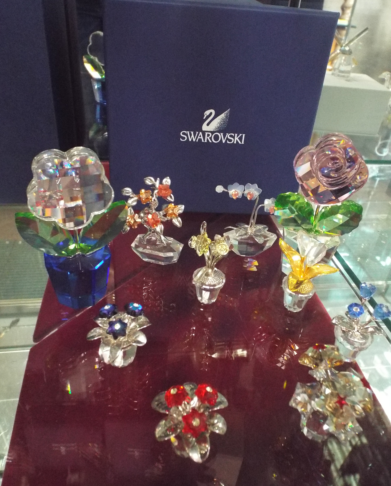 Collection of Swarovski crystal flower pots, to include two large pot