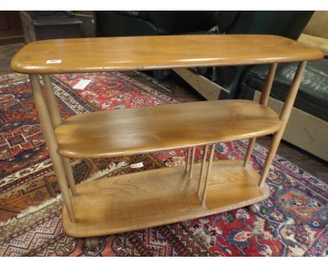 A Ercol light elm 3 tier trolley on casters 