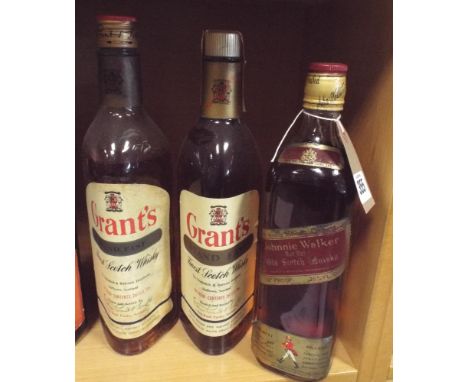 Two bottles of Grants Scotch whisky circa 1970 and an old bottle of Johnny Walker Red Label whisky 