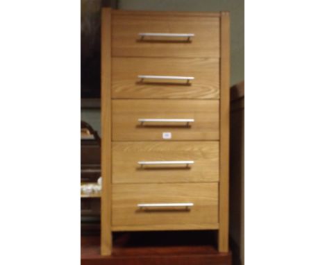 A 21" light oak chest of 5 drawers 