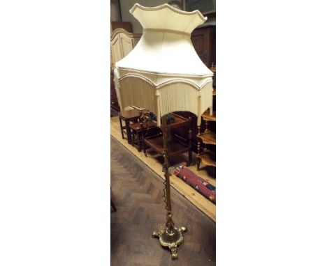 Heavy brass Corinthian column standard lamp with cream fringed shade 
