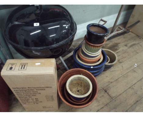 A kettle BBQ, a quantity of garden tools, garden pots and a flat pack cabinet 