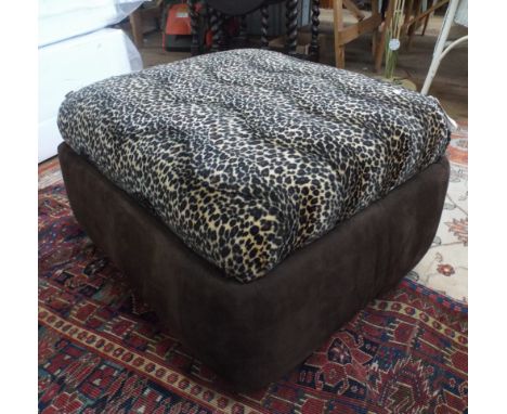 A leopard skin top pouffe with storage 