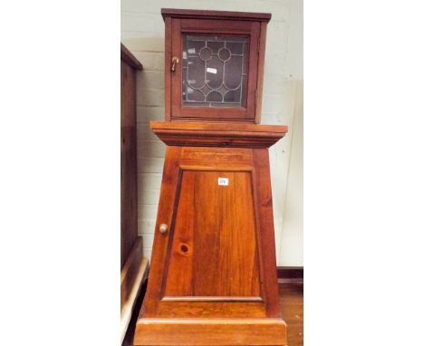 A pyramid shaped mahogany bedside cupboard and a small lead light wall cabinet 