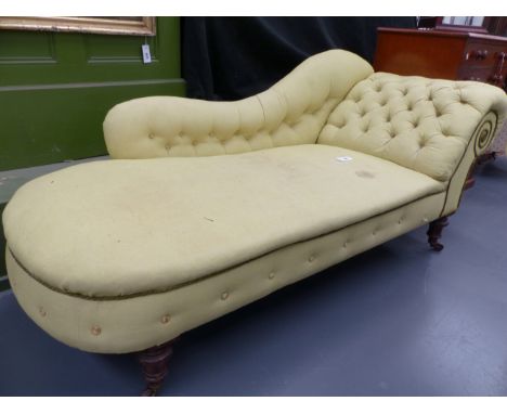 A VICTORIAN MAHOGANY SCROLL ARM CHAISE LONGUE WITH RING TURNED TAPERED LEGS ENDING IN CASTORS.   L.190cms.