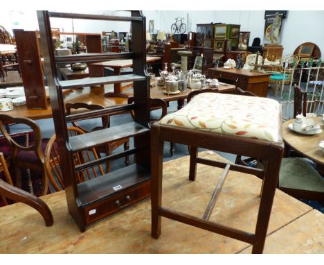 A MAHOGANY GEORGIAN STYLE DRESSING STOOL TOGETHER WITH A SMALL WATERFALL TYPE HANGING SHELF.  (2)