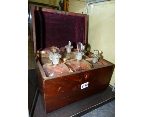 A REGENCY DOME TOP MAHOGANY DECANTER CASE, THE INTERIOR FITTED WITH SIX DECANTERS AND STOPPERS.
