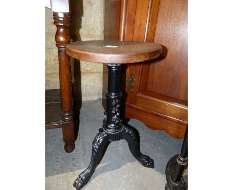 AN ANTIQUE CAST IRON INDUSTRIAL HEIGHT ADJUSTABLE STOOL.