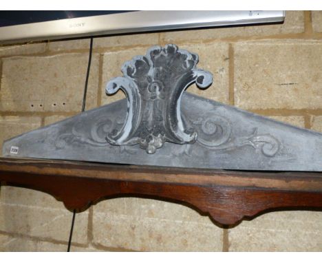 AN ANTIQUE ZINC ARCHITECTURAL PEDIMENT.