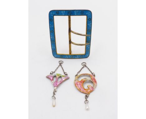 TWO PRECIOUS WHITE METAL,TESTED AS SILVER, ART NOUVEAU ENAMELLED PENDANTS TOGETHER WITH AN ENAMELLED GILT BUCKLE.  