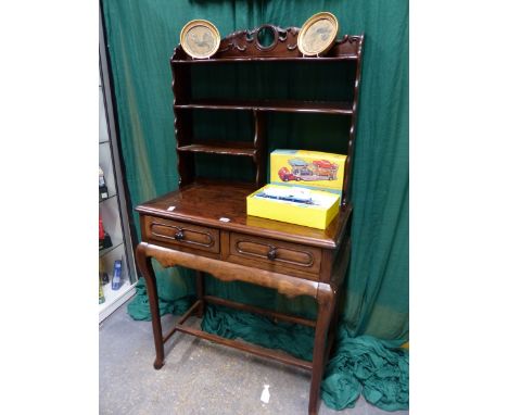 A CHINESE CARVED HARDWOOD SIDE TABLE, SHELF SUPERSTRUCTURE ABOVE TWO APRON DRAWERS.   H.142 W.76cms.