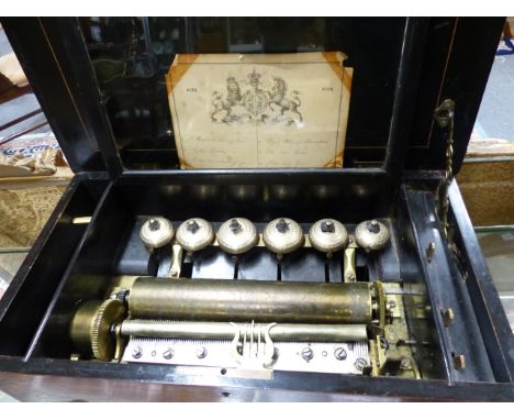 A 19th.C.LEVER WIND MUSICAL BOX PLAYING SIX AIRS OVER, 11" CYLINDER AND SIX BELLS IN ROSEWOOD AND INLAID CASE. W.52cms.