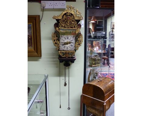 AN ANTIQUE DUTCH STAART WALL CLOCK WITH ORIGINAL PAINTED BRACKET AND PIERCED CAST METAL MOUNTS.