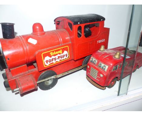 A TRI-ANG PUFF-PUFF TRAIN AND A WEST GERMAN TINPLATE FIRE ENGINE.