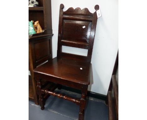 TWO EARLY CARVED OAK BACK STOOLS WITH RING TURNED FRONT LEGS AND STRETCHERS.