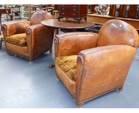 A PAIR OF FRENCH ART DECO BROWN LEATHER CLUB ARMCHAIRS WITH VELVET SEAT CUSHIONS.