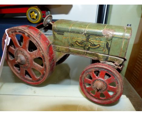 AN EARLY BING TINPLATE CLOCKWORK TOY TRACTOR MARKED BINGWERK, GERMANY.