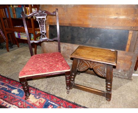 AN OAK JOINT STOOL WITH SHAPED CARVED FRIEZE TOGETHER WITH AN EDWARDIAN NURSING CHAIR.   (2)`