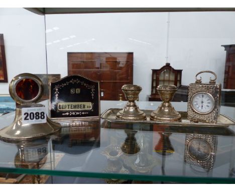 A HALLMARKED SILVER CASED DRESSING TABLE CLOCK WITH A FRENCH MOVEMENT, A SILVER AND TORTOISE SHELL INKWELL AND MATCHING DESK 