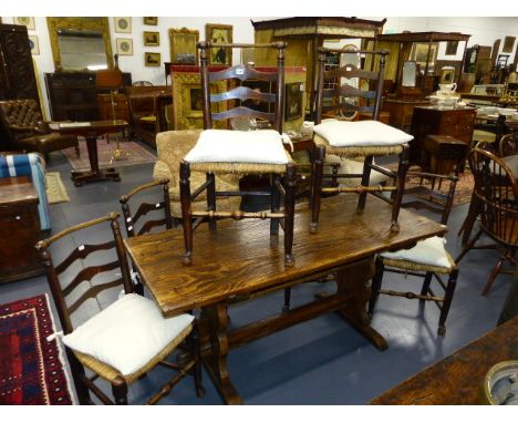 A SET OF SIX 19th.C.RUSH SEATED ASH LADDER BACK CHAIRS WITH TURNED CREST RAILS.