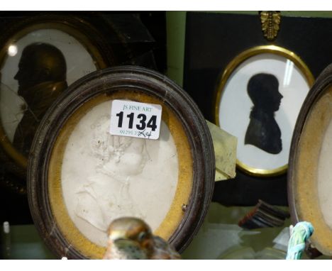 A PAIR OF TASSIE TYPE LATE 18th.C.OVAL PORTRAIT PLAQUES OF A GENTLEMAN AND A LADY AND TWO MIERS TYPE OVAL SILHOUETTES.