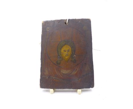 AN EARLY POLYCHROME PANEL OR ICON DECORATED WITH A PORTRAIT OF CHRIST, INSCRIBED AND UNFRAMED.   11 x 8.5cms.